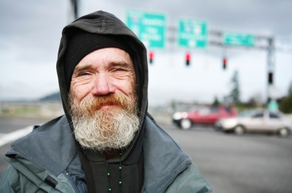 Heroic homeless man smiles